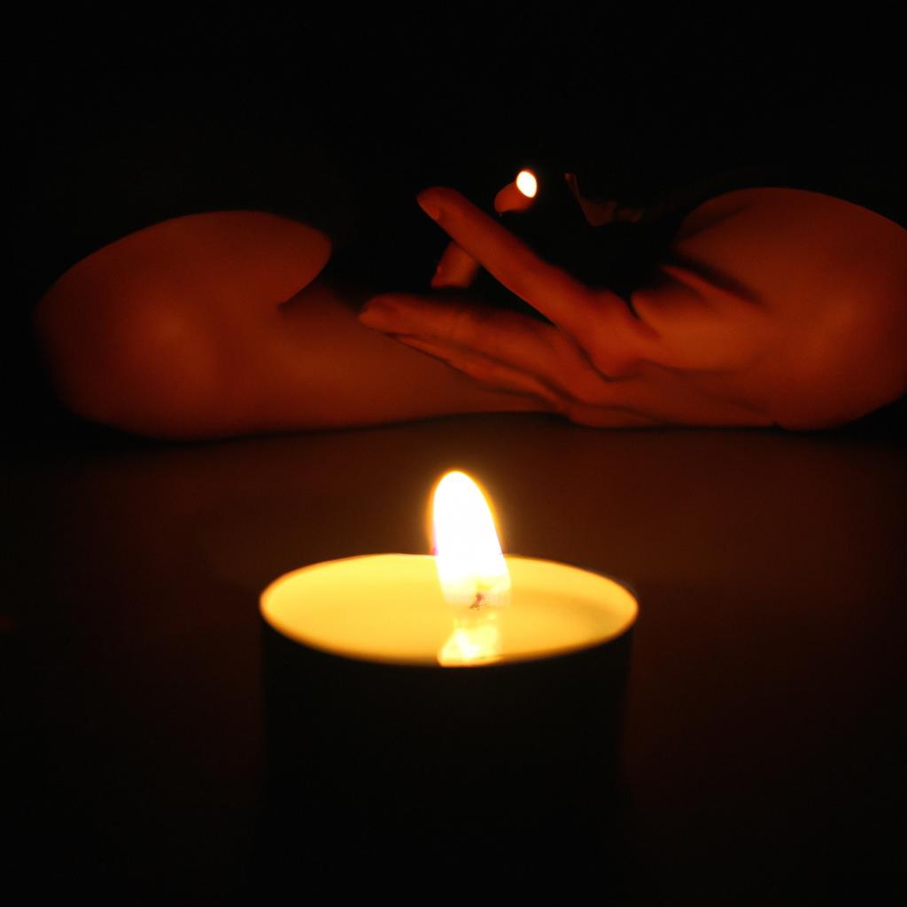 Person meditating in candlelight